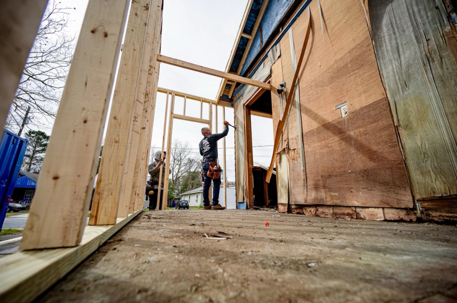 Crew framing a new wall section for a home addition